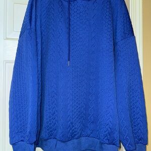 Woman’s Blue Sweater